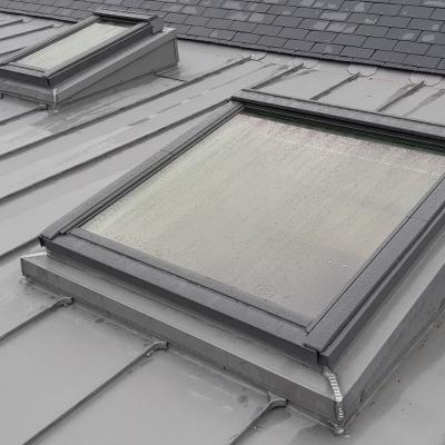 Pose d'une couverture en ardoises + Velux